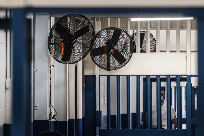 Fans hang in a hall's corner at Louie C. Powledge Unit, a Texas Department of Criminal...