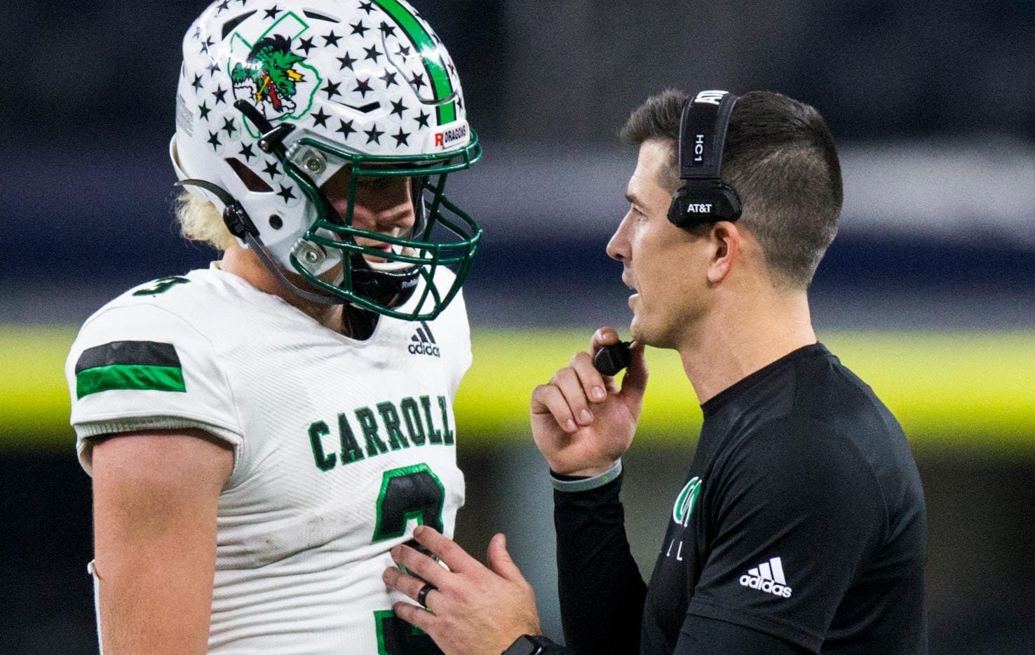 Southlake Carroll quarterback Quinn Ewers talks with head coach Riley Dodge during the...
