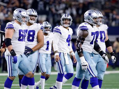 Dallas Cowboys quarterback Dak Prescott (4) and the offense walk off the field after being stopped on 4th down against the Las Vegas Raiders in the fourth quarter at AT&T Stadium in Arlington, November 25, 2021. The Cowboys lost in overtime to the Raiders, 36-33.