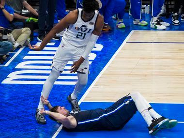 Dallas Mavericks guard Luka Doncic (77) hit the floor after being fouled by Utah Jazz center...
