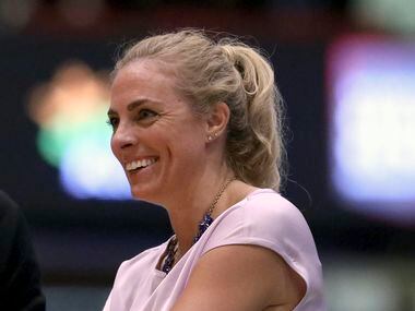 Atlanta Dream head coach Nicki Collen smiles during a WNBA basketball game against the New York Liberty, in New York.