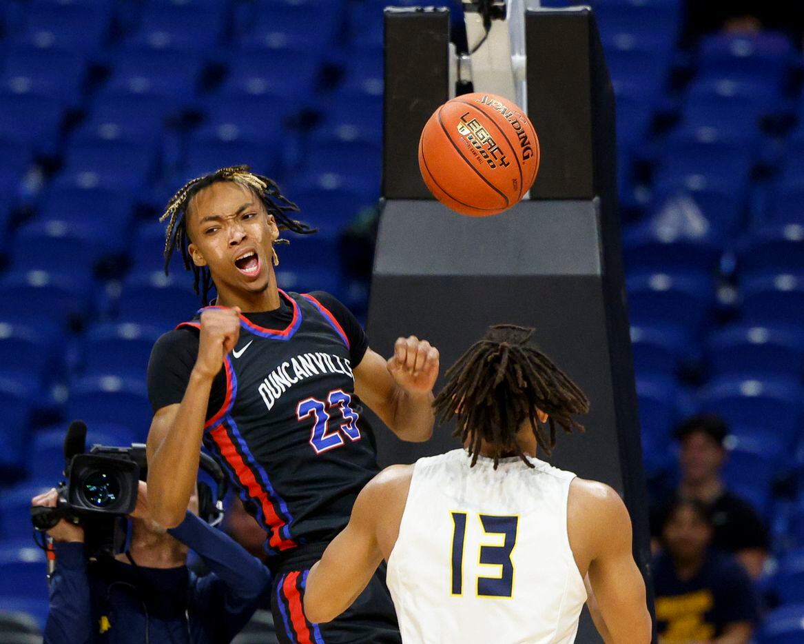 Duncanville forward Cameron Barnes (23) reacts after dunking the ball as McKinney guard...