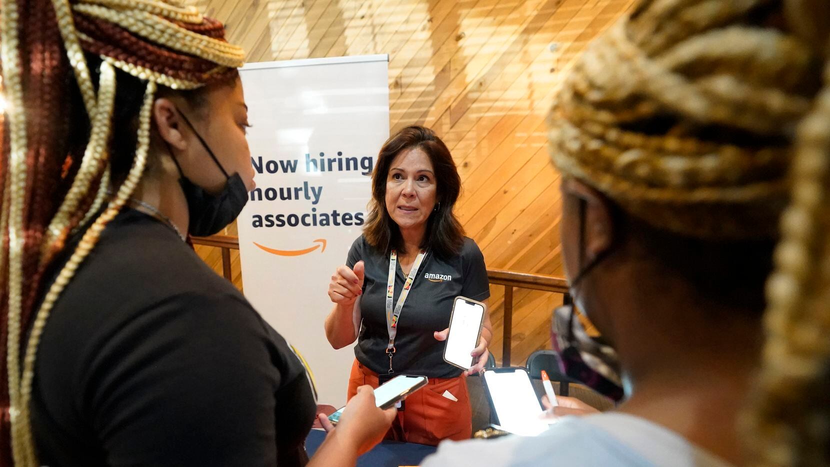 In Mississippi, Amazon engagement specialist Brenda Torres (center) discusses opportunities...