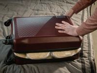 Look closely inside the bulging suitcase in this teaser photo for H-E-B's Super Bowl LVII...