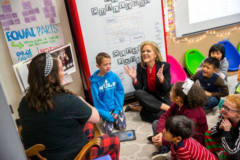 In December 2019, Richardson ISD Superintendent Jeannie Stone (center) sat with students...