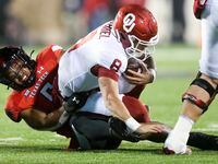 Texas Tech defensive back Kosi Eldridge (6) sacks Oklahoma quarterback Dillon Gabriel (8)...