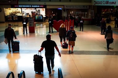 Passengers head toward baggage claim at Dallas Love Field on Tuesday, April 9, 2024.