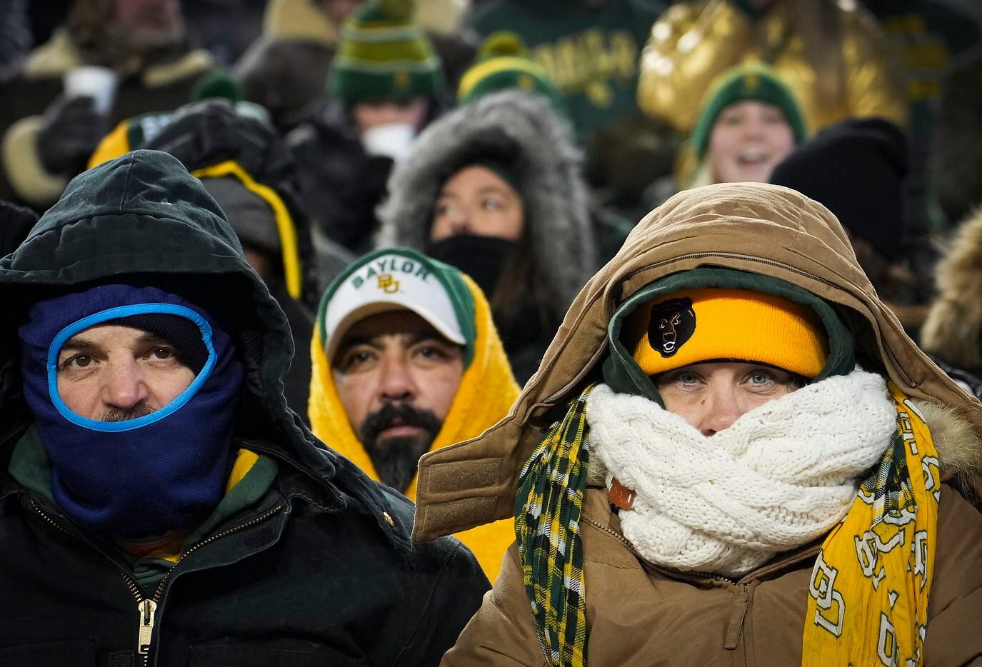Baylor fans bundle up against the cold before the Armed Forces Bowl NCAA football game...