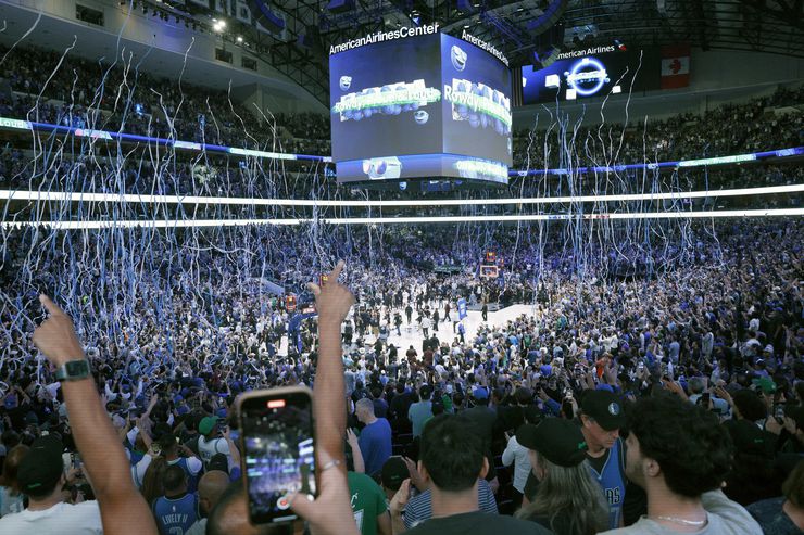 Dallas Mavericks fans cheer after the Mavericks defeated the LA Clippers in Game 6 of an NBA...