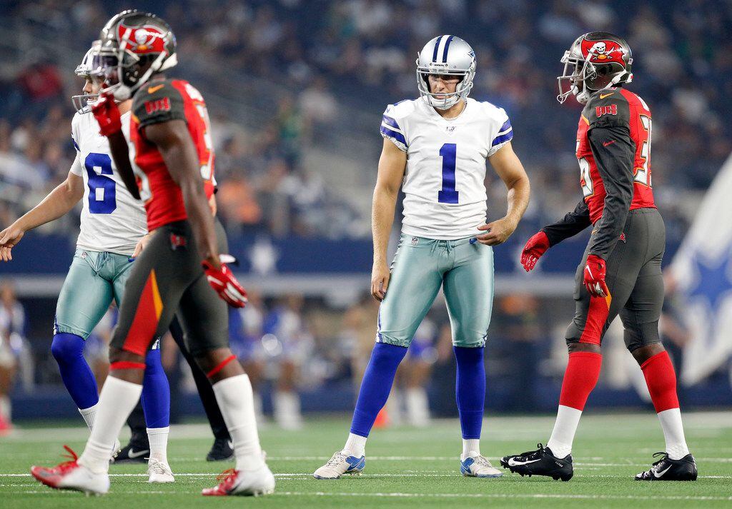 Dallas Cowboys punter Kasey Redfern (1) reacts after missing an extra point during the first quarter against the Tampa Bay Buccaneers in their preseason game at AT&T Stadium in Arlington, Texas, Thursday, August 29, 2019.