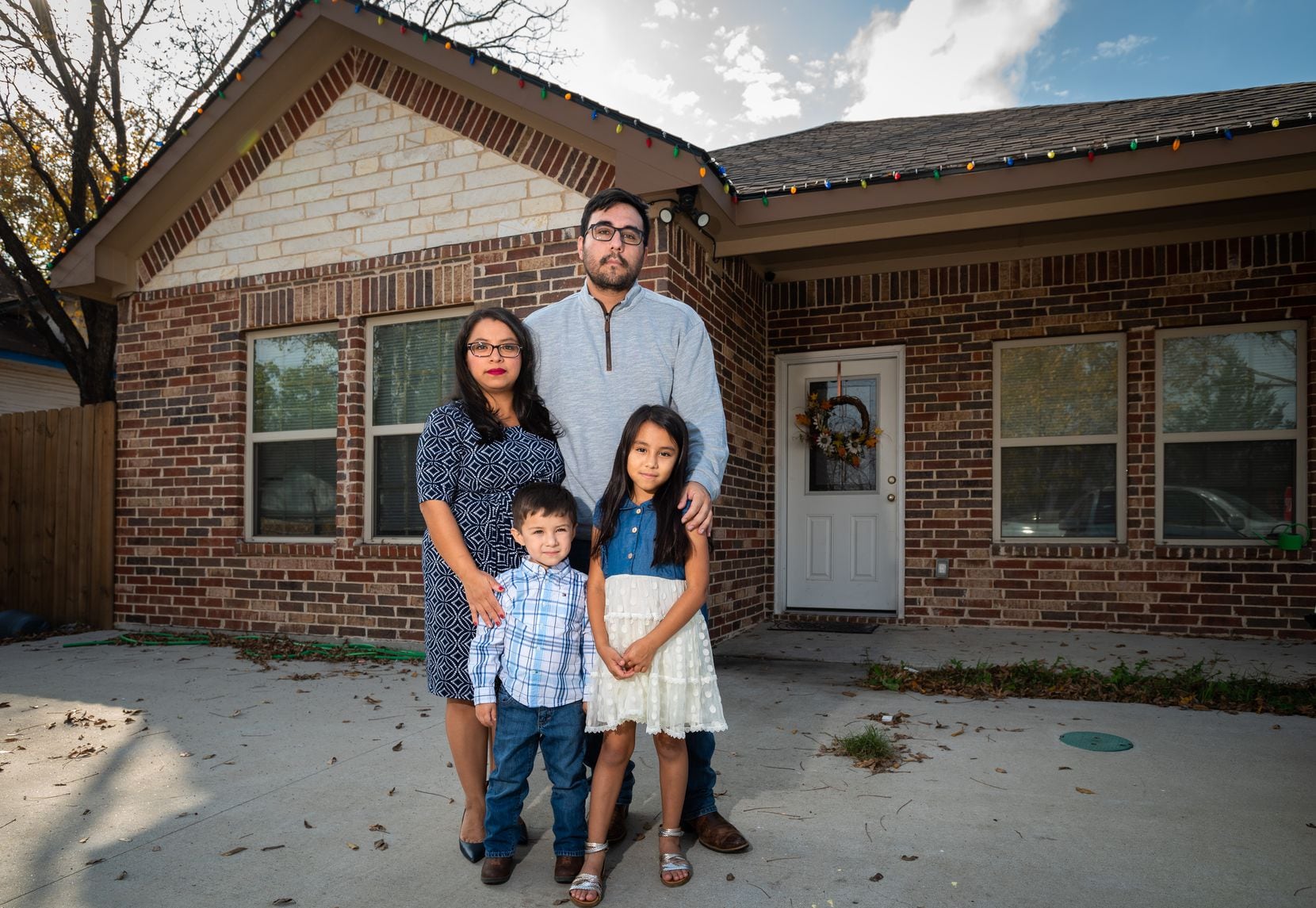 Laura Baez-Torres, who grew up in West Dallas, and husband Jake with their children...