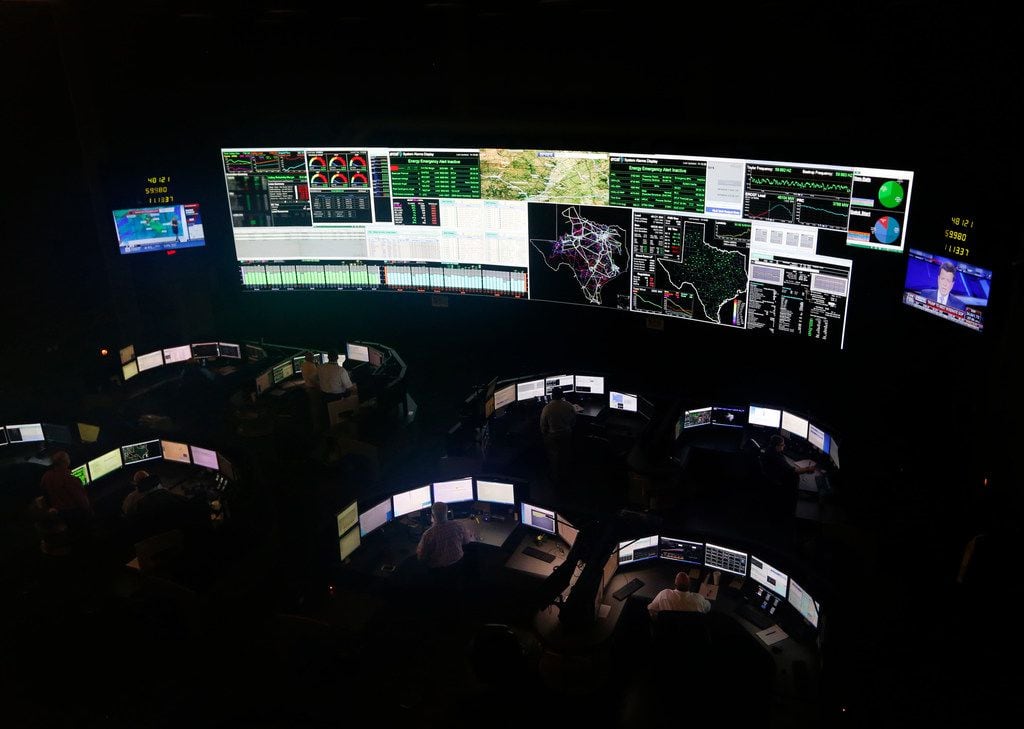 System operators work in the command center of the Electric Reliability Council of Texas in...