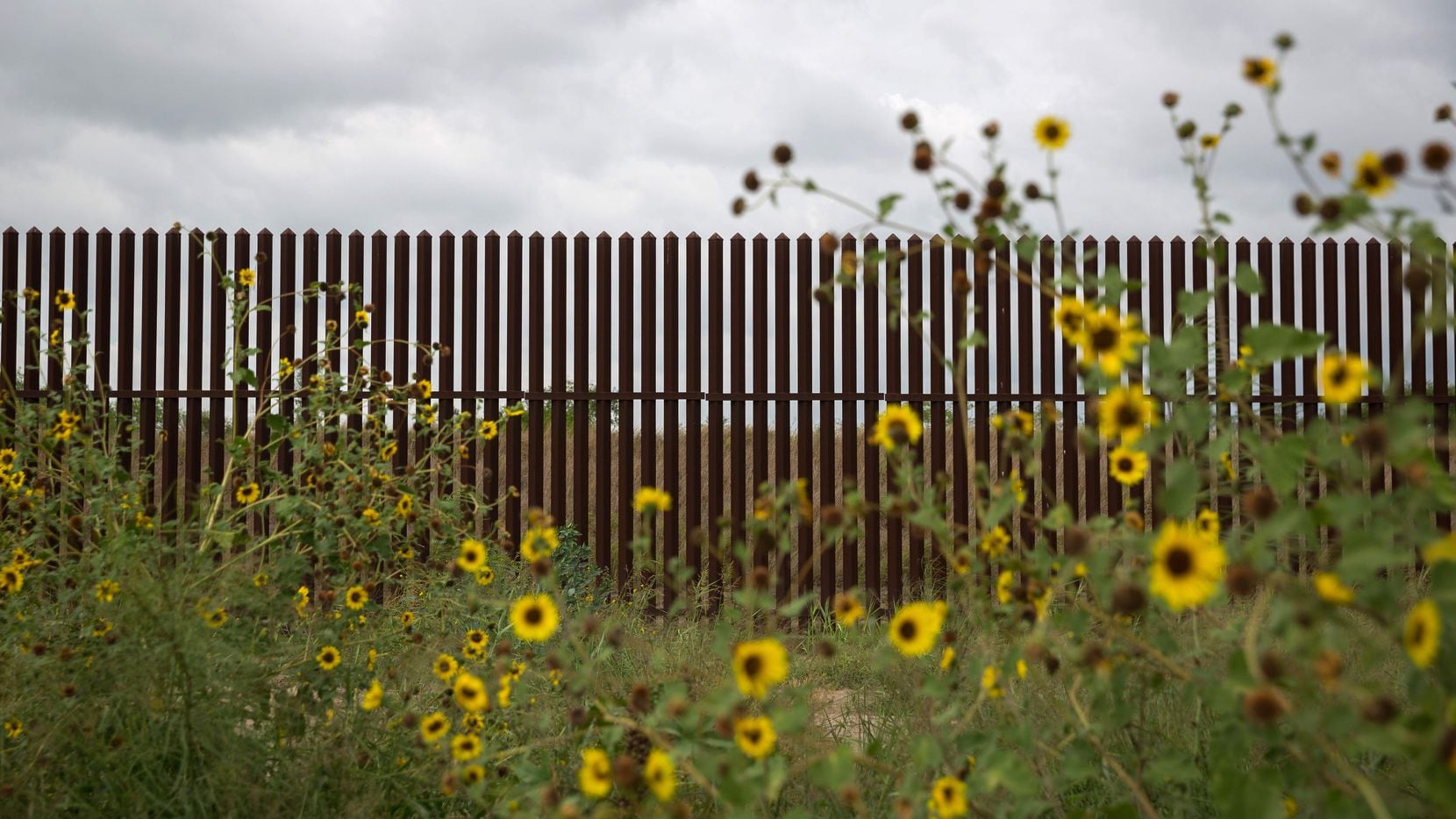 This photo shows a section of the US-Mexico border fence on June 18, 2018 near San Benito,...