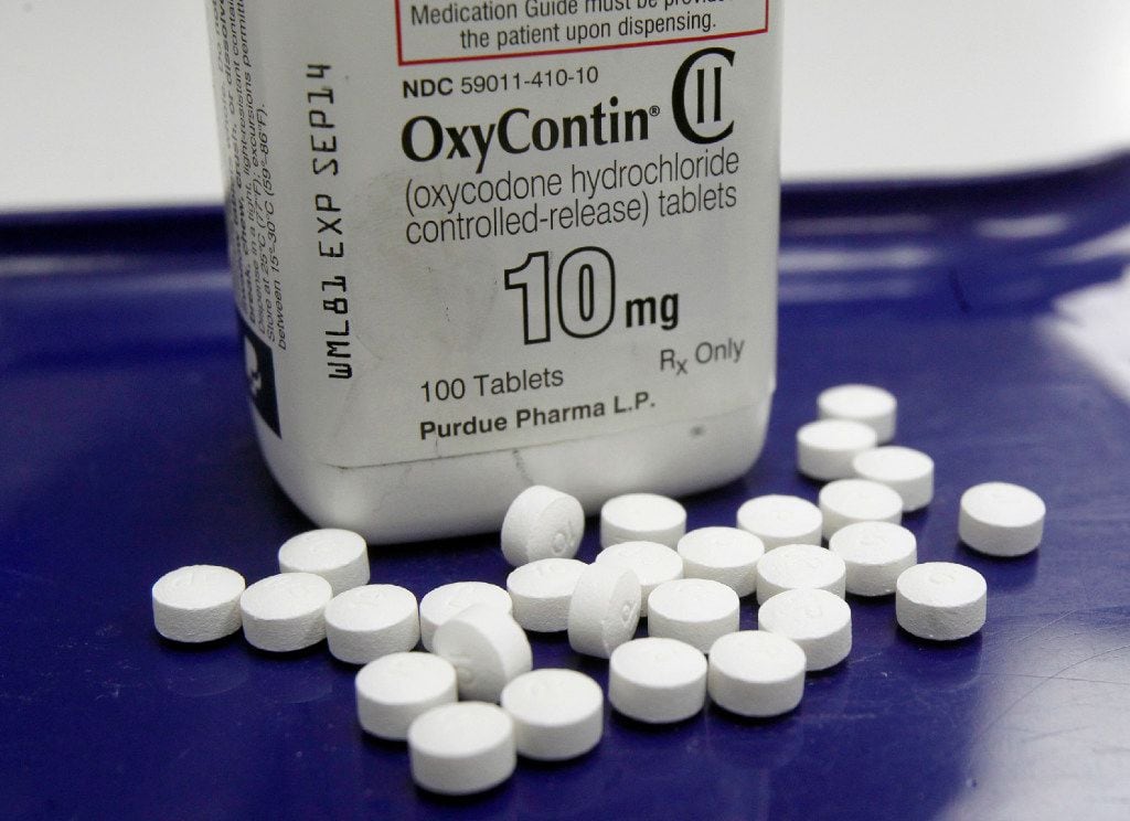 This Feb. 19, 2013, photo, shows OxyContin pills arranged for a photo at a pharmacy in...