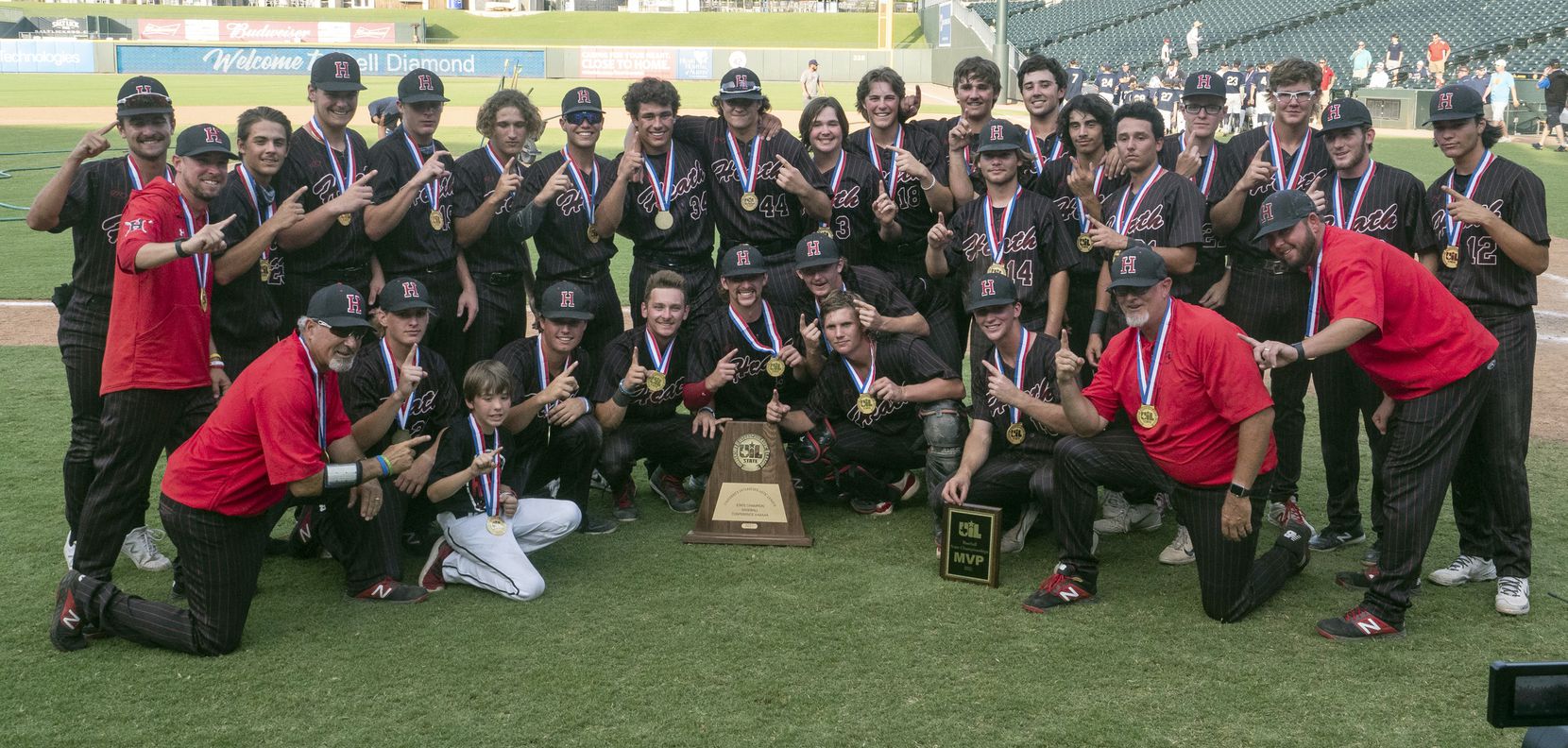 Rockwall-Heath gets a team photo taken with the UIL state trophy after defeating Keller in...