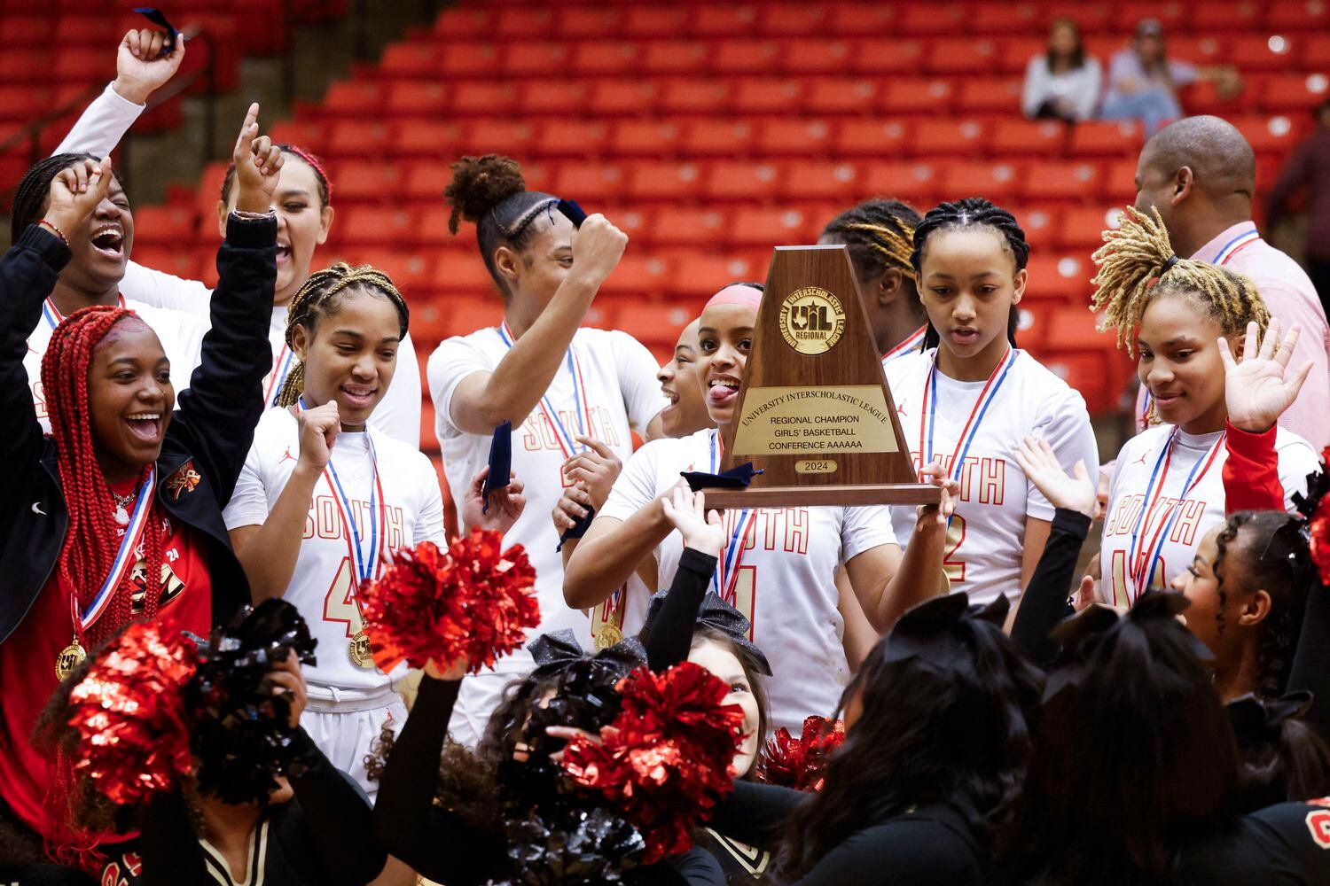 South Grand Prairie celebrate following a 59-44 victory over Fort Worth Boswell High in the...