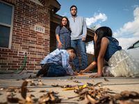 Laura Baez-Torres and husband Jake bought their West Dallas home, their first, in 2018. Their children, Esteban, 3, and Angelique, 7, drew on the driveway with chalk in early December.
