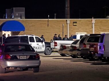 Police officers work the scene of a shooting at the Texas Tech Police Department.