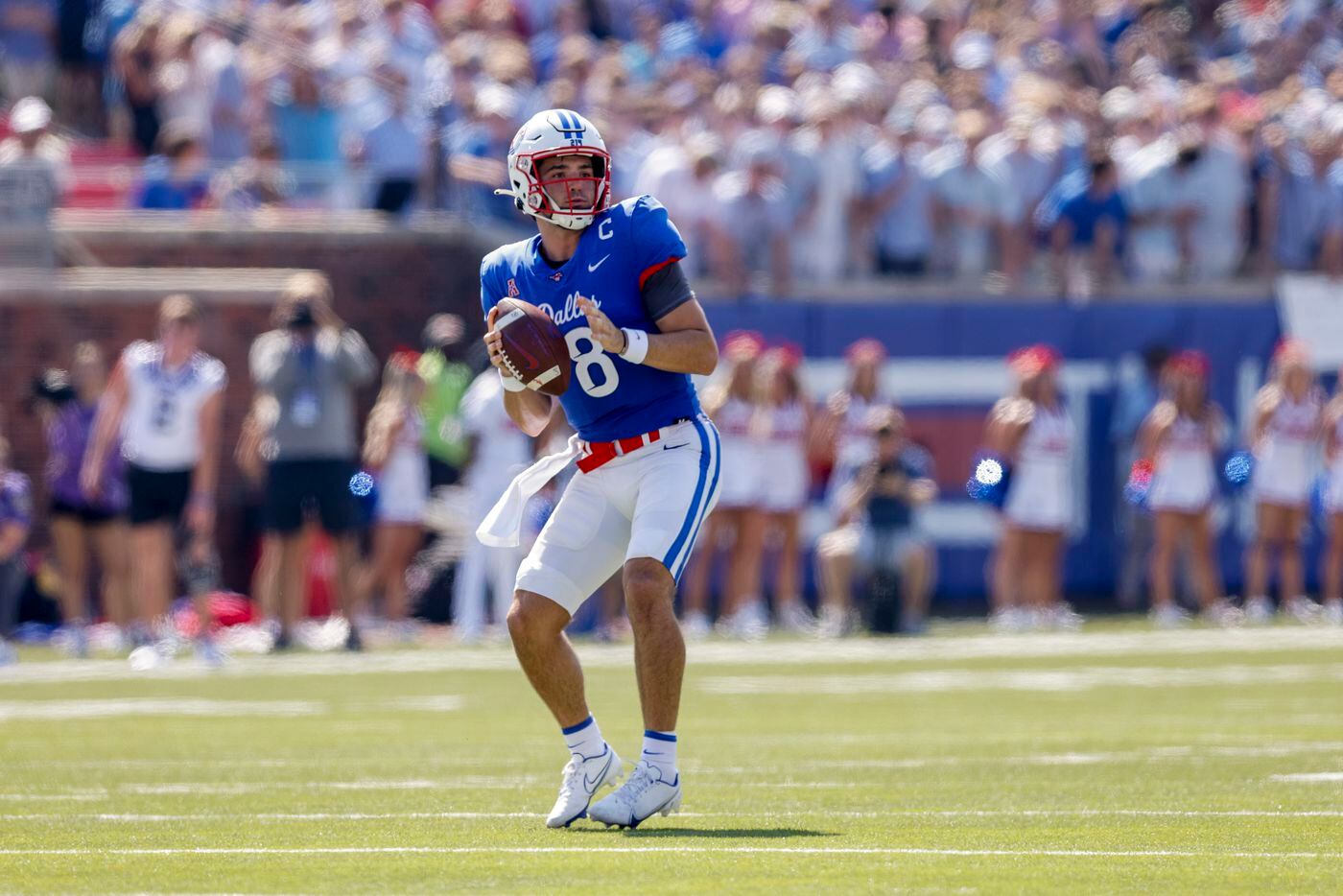 SMU quarterback Tanner Mordecai (8) looks to throw the ball during the first half of a game...