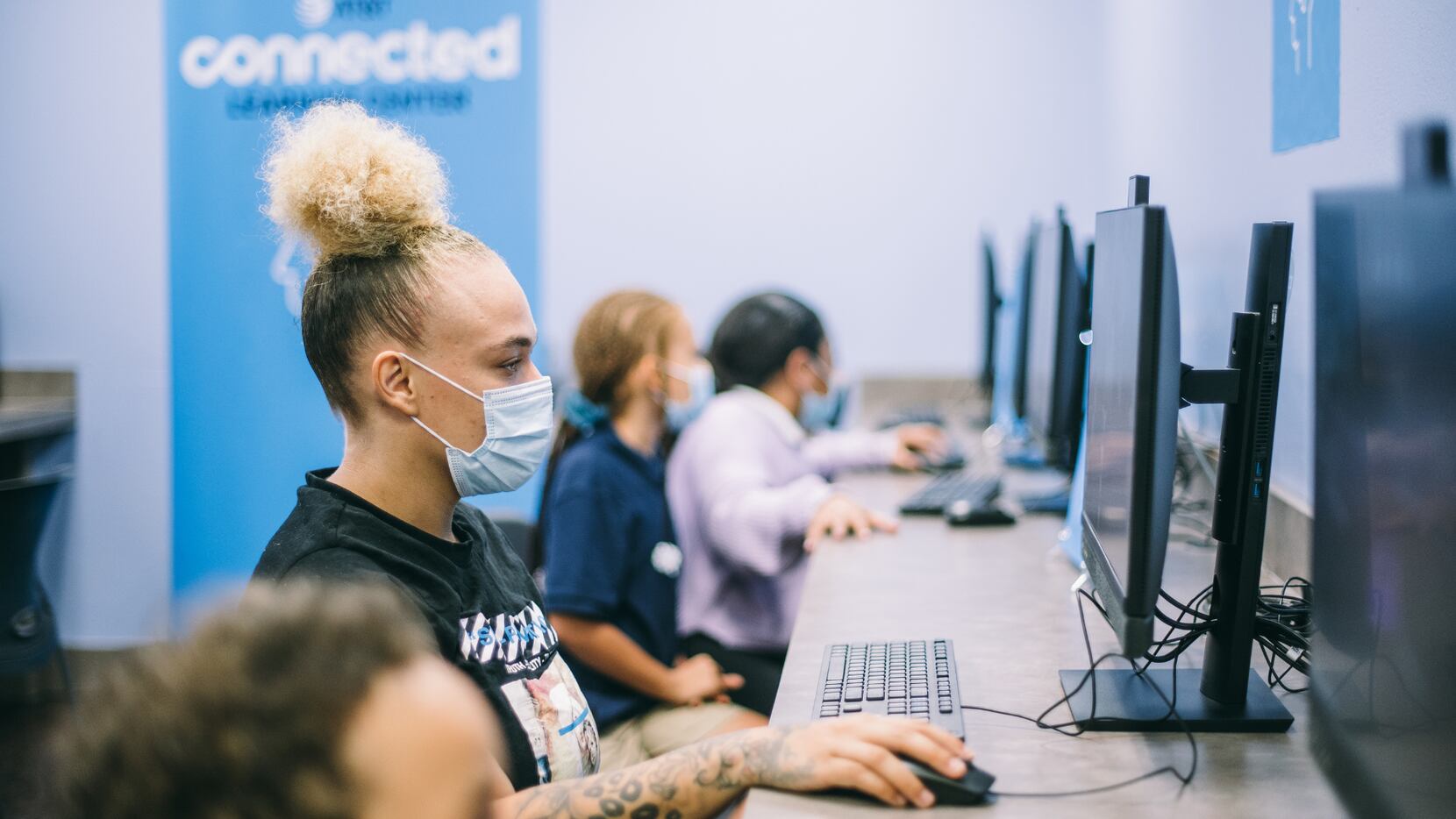 Students and parents use the AT&T Connected Learning Center at Family Gateway. One parent...