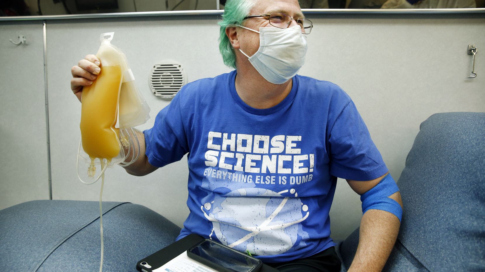 Matt Burnside (left), of Dallas, is proud of his 650ml plasma donation at a mobile Carter...