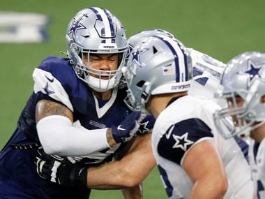 Dallas Cowboys defensive tackle Trysten Hill (97) attempts to get past Dallas Cowboys guard Cody Wichmann (78) in practice during training camp at the Dallas Cowboys headquarters at The Star in Frisco, Texas on Tuesday, August 25, 2020.