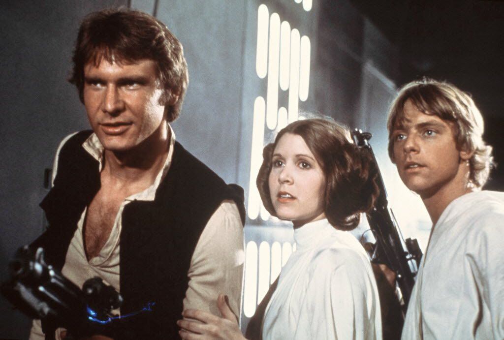 Harrison Ford as Han Solo, Carrie Fisher as Princess Leia Organa and Mark Hamill as Luke...