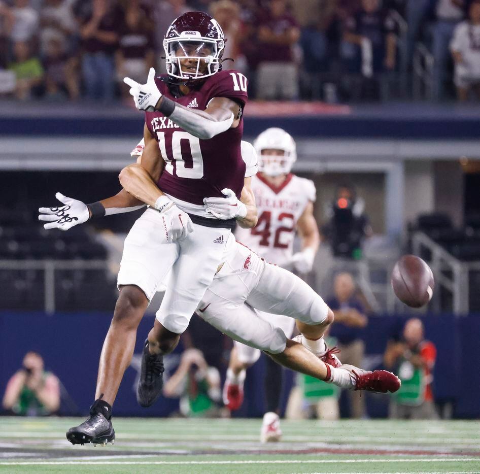 Texas A&M defensive lineman Fadil Diggs (10) misses a pass while getting tackled by Arkansas...