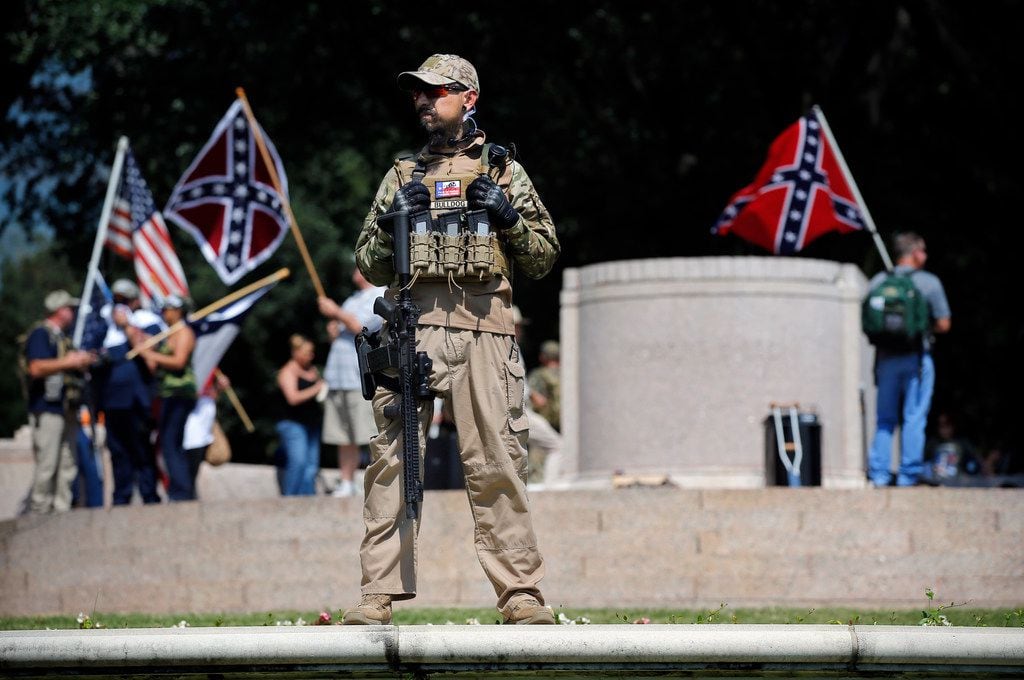 A Texas Liberty Coalition security person stood guard over This Is Texas Freedom Force...