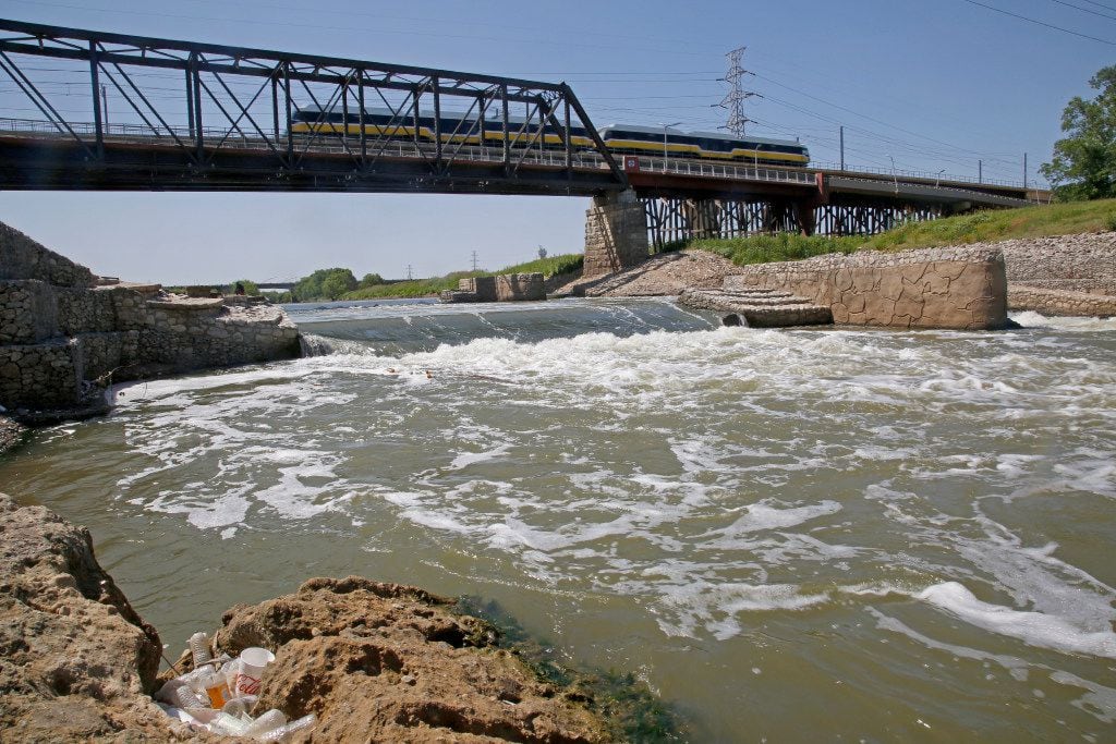 Water rushes over the second stage of the Standing Wave feature at the Santa Fe Trestle on...