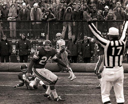 Dallas Cowboys wide receiver Drew Pearson (88 - third from left) looks back to see a referee...