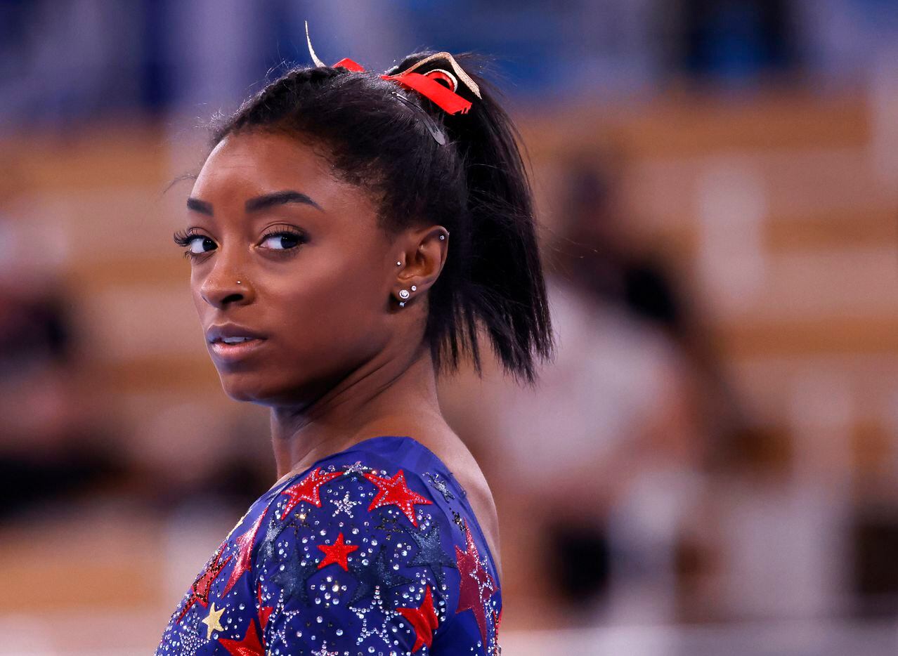USA’s Simone Biles before competing on the uneven bars in a women’s gymnastics event during...