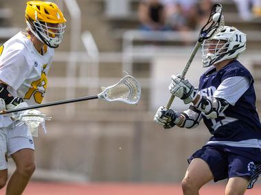 Episcopal School of Dallas’ Mac Rodvold takes a shot past St. Mark's Henry Boykin during the...