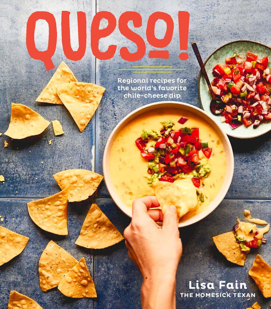 The cover of Queso! by Lisa Fain (Ten Speed Press, $15) features Austin Diner-Style Queso, topped with guacamole and pico de gallo. 