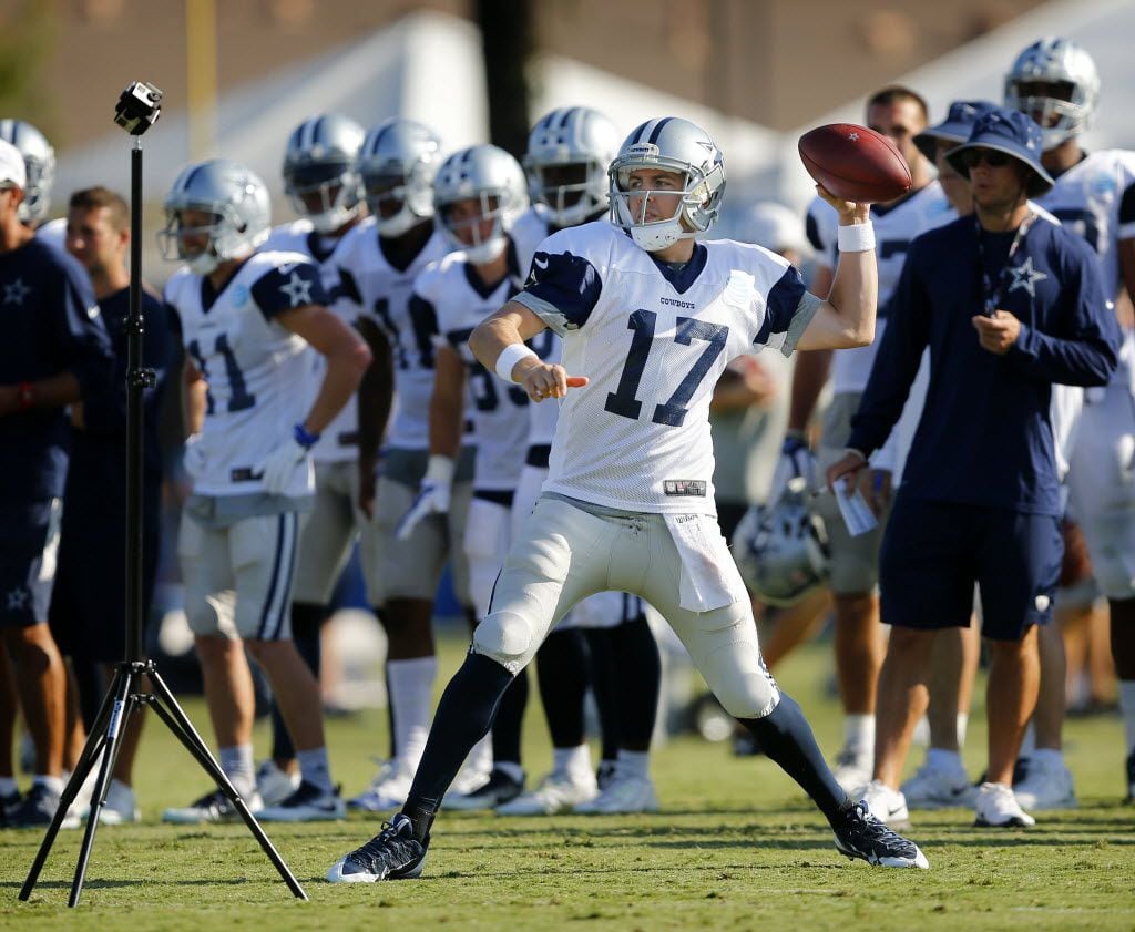 Dallas Cowboys quarterback Kellen Moore (17) throws the ball during afternoon practice at...