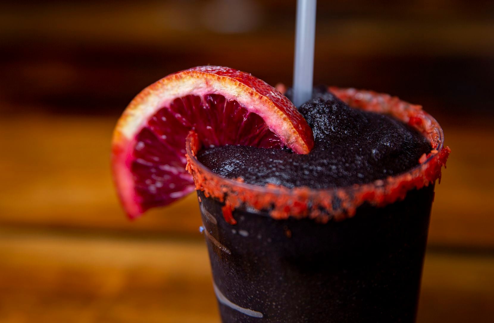 The owners won't say what makes their frozen margarita black at Terry Black's Barbecue. The...