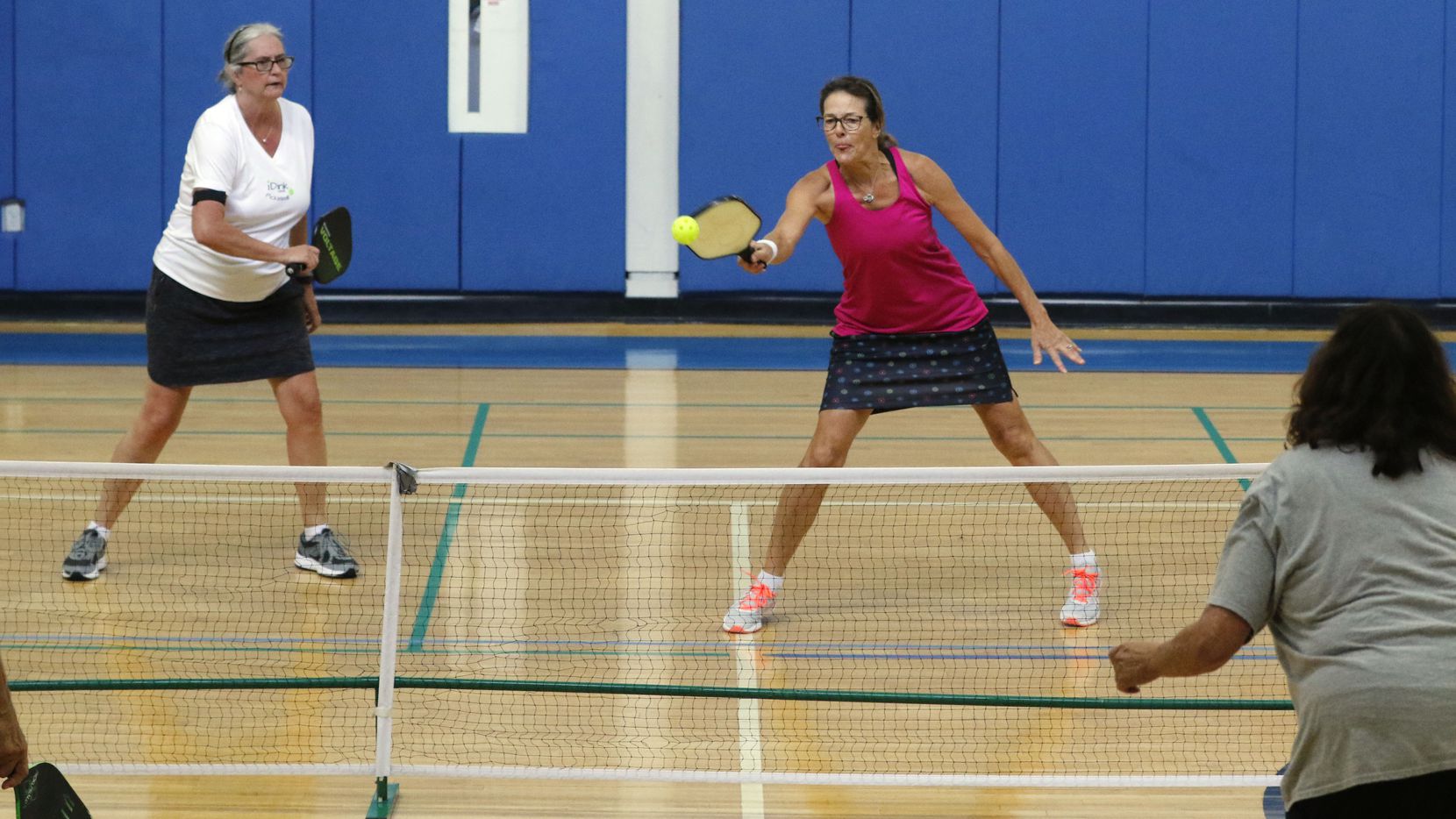 Pickleball players volley during a game at Ridgewood-Belcher Recreation Center in Dallas in...