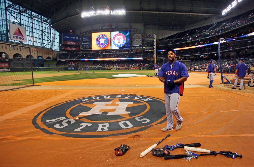 Texas shortstop Elvis Andrus talks with fans during batting practice before the Texas Rangers vs. Houston Astros season opener at Minute Maid Park in Houston on Sunday, March 31, 2013. (Louis DeLuca/The Dallas Morning News)