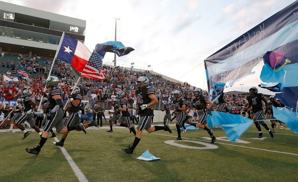 Denton Guyer takes the football field during introductions before a football game against Southlake Carroll High School at C.H. Collins Complex in Denton, on Friday, October 4, 2019. (Vernon Bryant/The Dallas Morning News)