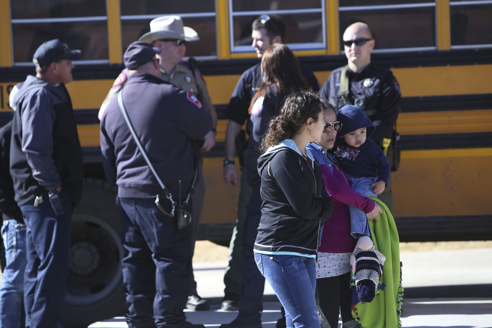 Parents pick up their children at Stafford Elementary school after a shooting at Italy High...