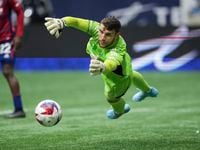 FC Dallas goalkeeper Maarten Paes dives for the ball as it goes wide of the goal during the...