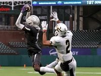 Lewisville defensive back Tony-Louis Nkuba (5) comes up with a interception in front of...