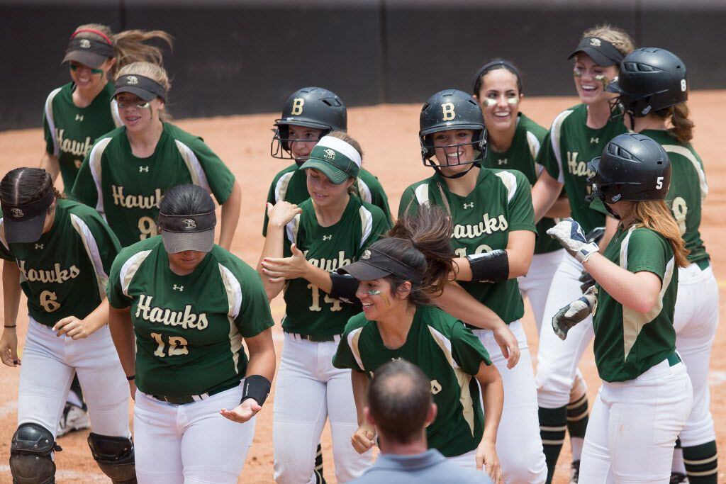 Bridville junior first baseman Calie Burris, center-right, is surrounded by her teammates at home plate after a solo home run in the fifth inning against Frisco at the UIL State 5A Semi-Finals at McCombs Field in Austin, Texas on June 3, 2016. Birdville defeated Frisco 10-1 and advances to the finals on Saturday. (Julia Robinson/Special Contributor)