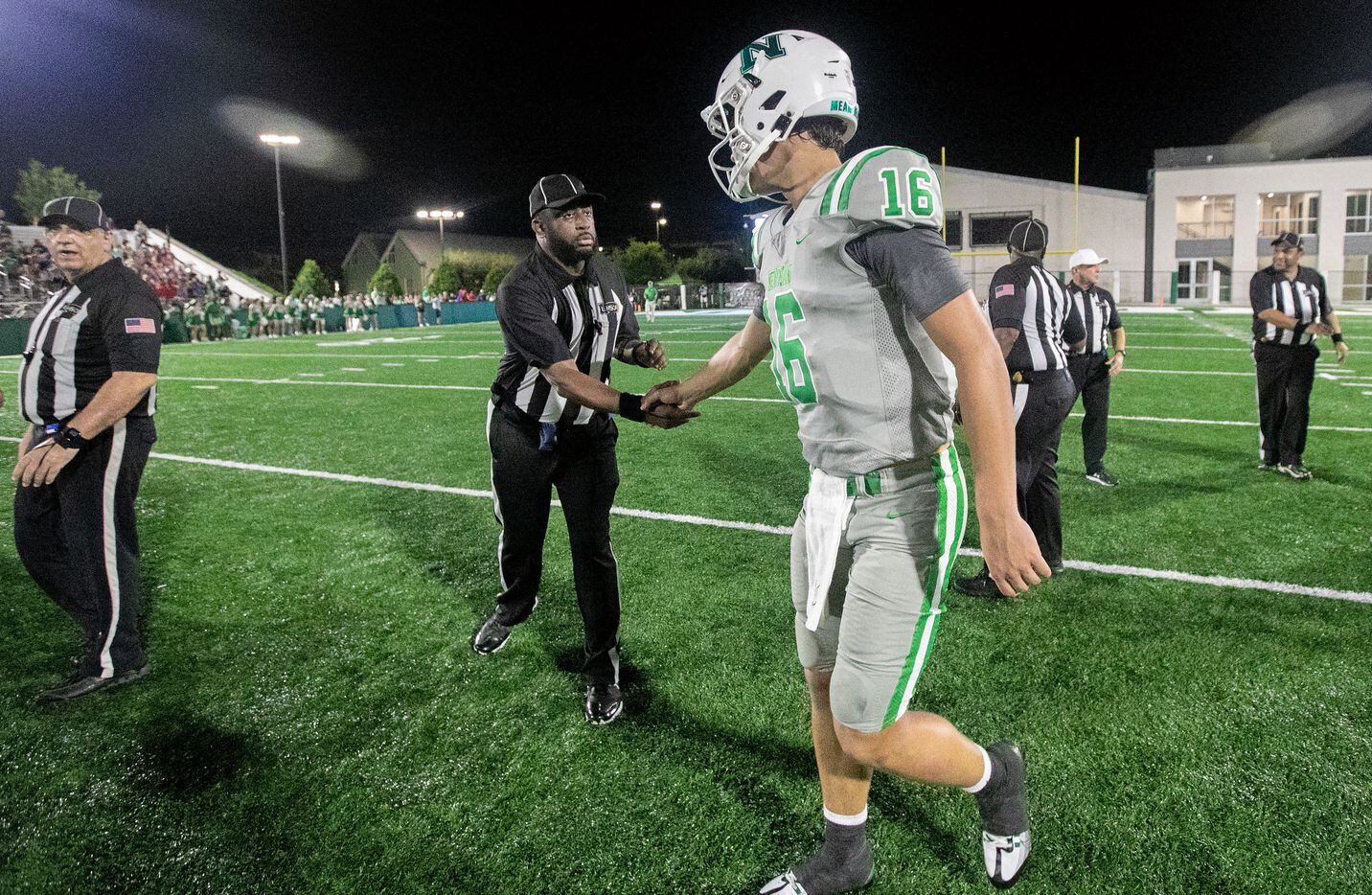 Arch Manning shakes hands with referees, coaches and opponents as Newman High School defeats...
