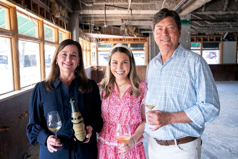 Restaurateur Randy DeWitt, right, is joined by his daughter Amanda DeWitt, center, and...