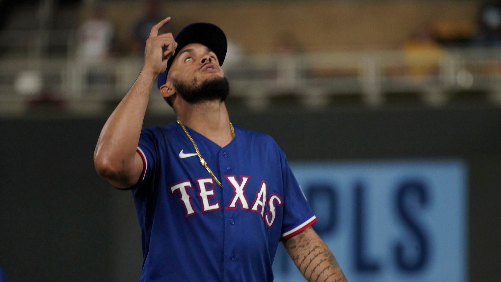 Texas Rangers relief pitcher Jonathan Hernandez celebrates the final out against the...