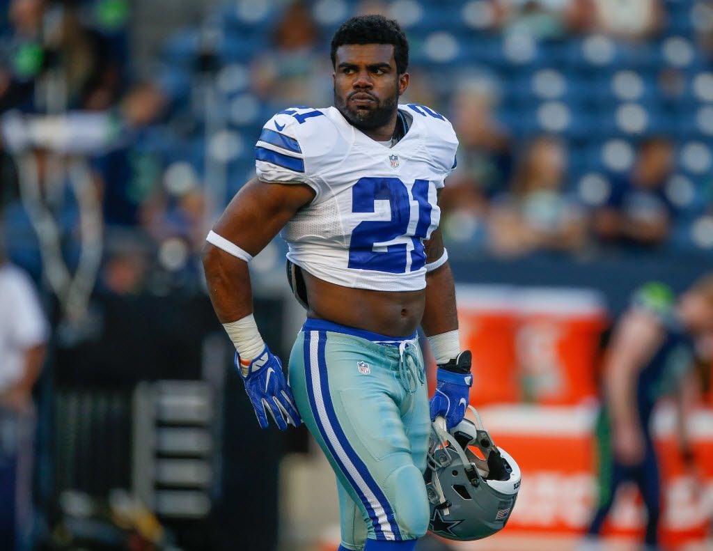 SEATTLE, WA - AUGUST 25:  Running back Ezekiel Elliott #21 of the Dallas Cowboys looks on...