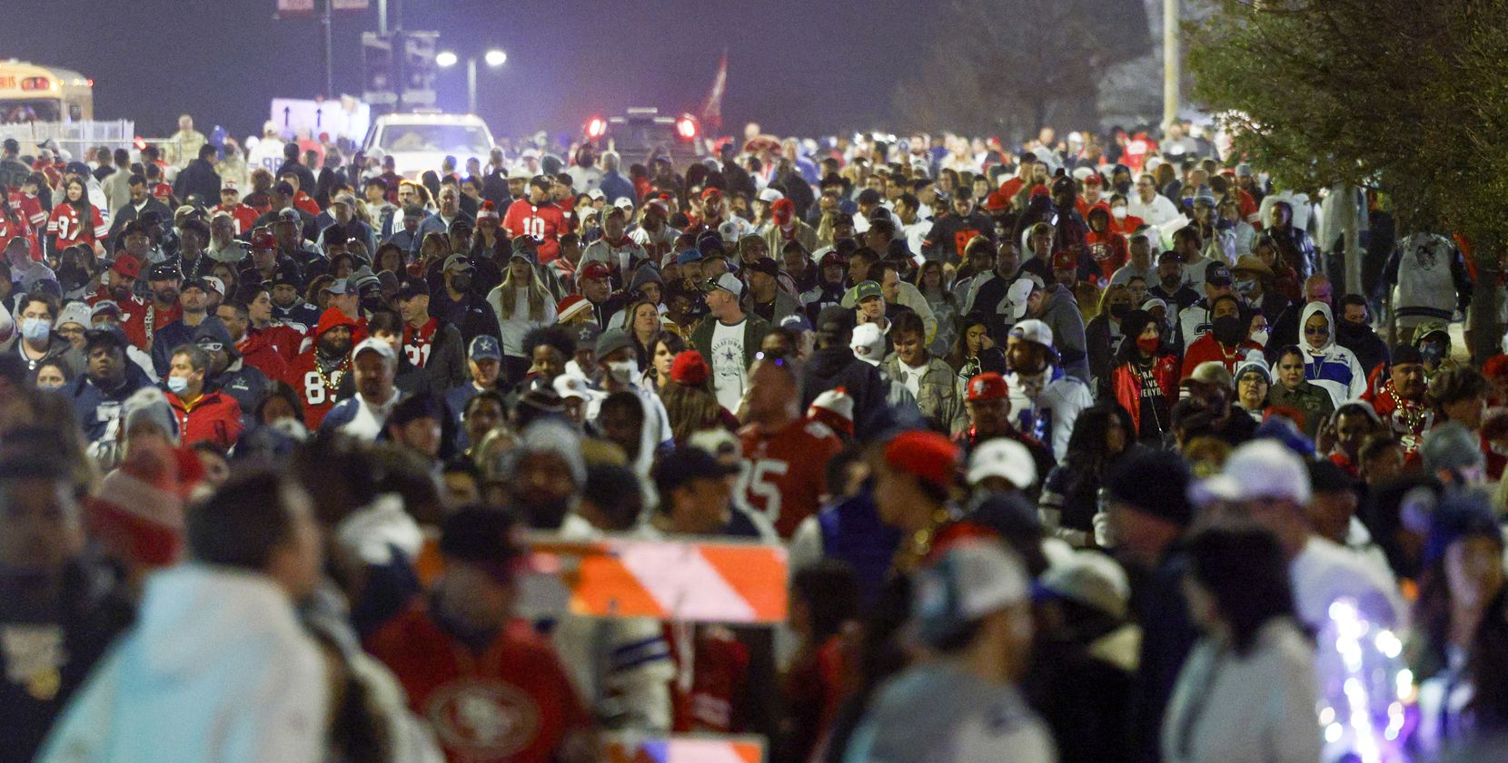 Football fans fill AT&T Way near East Randol Mill Road after an NFL wild-card playoff game...