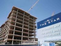 An 11-story office tower is  is already under construction on the Dallas North Tollway that...