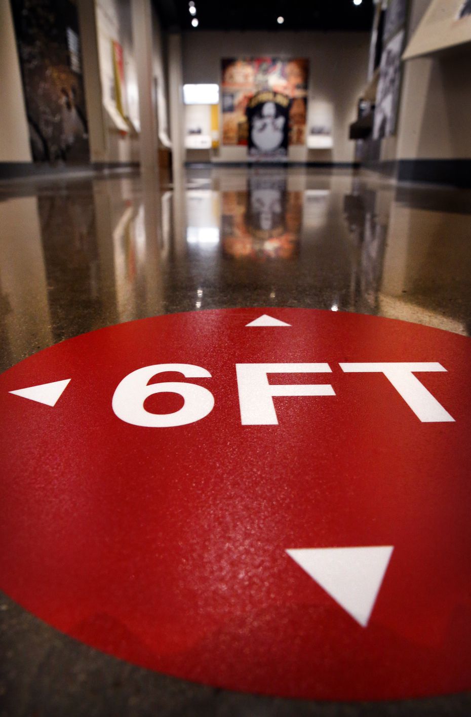 Markers on the floor will remind people to keep 6 ft. spacing while viewing exhibits in the...